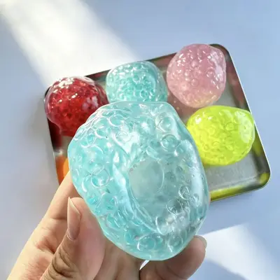 Vaseline-Perlen Knautschball, langsam rückstellend, bunte flache Perlen