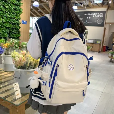 Grenzüberschreitender Rucksack koreanischer Stil Instagram-Stil vielseitiger Universitäts-Schülertasche Damen japanischer Stil Nylon-Mittelschüler-Rucksack großer Kapazität