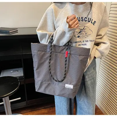 Einfache lässige Outdoor-Sport-Alltags-Pendel-robuste leichte großvolumige Unisex-Schulter-Handtasche mit Karomuster