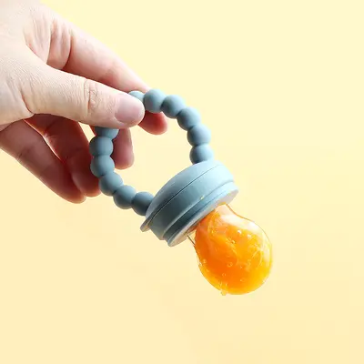 Baby fruit food supplement, baby pacifier, teether, food-grade silicone fruit and vegetable chewing toy, wholesale product for babies and children.