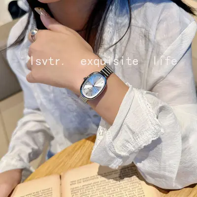 Gold women's quartz watch with steel band