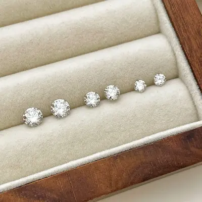 Pure Silver 999 Ear Studs with four-claw diamond setting