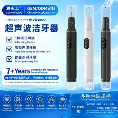 Ultrasonic water spray dental cleaner