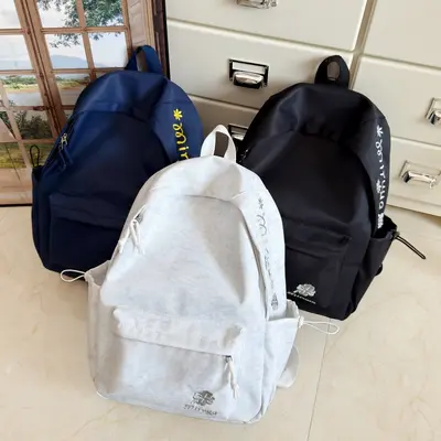 Öğrenci Sırt Çantası Kore Tarzı Saf Renk Harf İşlemeli Büyük Kapasiteli Sırt Çantası Kampüs Ders Outdoor Seyahat Çift Omuz Çantası Uluslararası