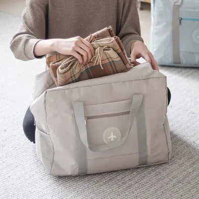 圆标飞机旅行收纳包加厚大容量衣服手提收纳袋旅游行李箱整理袋厂