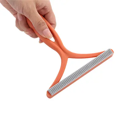 Manual double-sided lint remover for clothing and fabrics