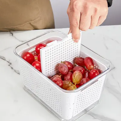 Kitchen refrigerator storage container with dividers and drain