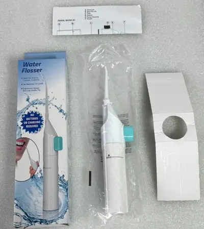 Portable manual water flosser oral irrigator