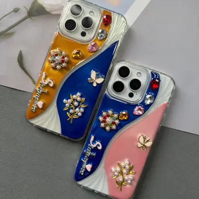 iPhone 17 Pro Max case with pearl necklace and butterfly details