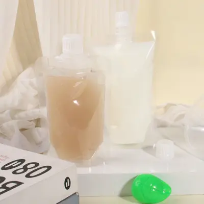 Tek kullanımlık şeffaf emzikli torba soya sütü torbası geleneksel Çin tıbbı sıvı ambalaj torbası meyve suyu içecek plastik torba yoğurt mühürlü torba
