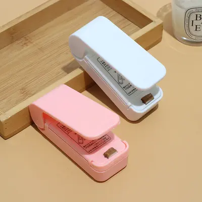 Mini yapıştırma makinesi, küçük ev tipi plastik yapıştırma makinesi, aperatif yapıştırma artefaktı, taşınabilir nem geçirmez elle preslenmiş plastik torba yapıştırma makinesi