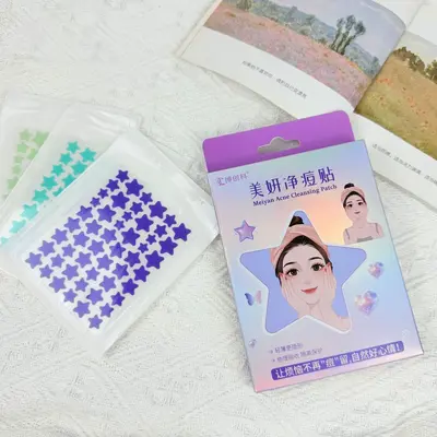Star-shaped pimple patches, pus-absorbing, can be applied over makeup