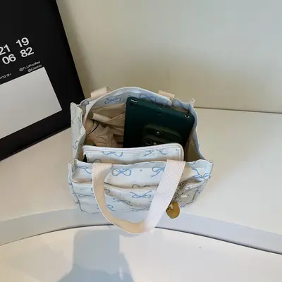 Moda bento çantası toptan yeni günlük hafif el çantası Kore versiyonu yüksek kaliteli seyahat ve iş çok yönlü el çantası