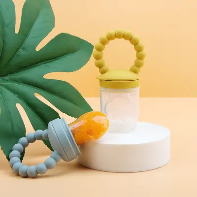 Baby fruit food supplement, baby pacifier, teether, food-grade silicone fruit and vegetable chewing toy, wholesale product for babies and children.
