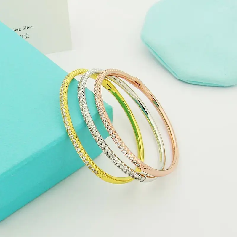 Gold-plated semi-circle bracelet with single row crystals