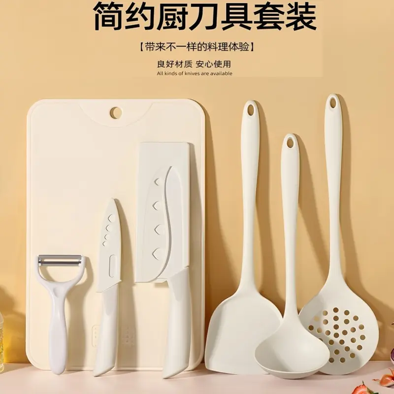 Kitchen knife and cutting board with silicone spatula and spoon