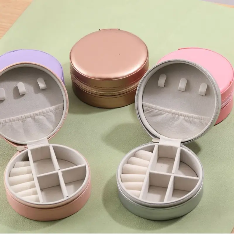 Runde tragbare Schmuckschatulle PU Schmuck-Aufbewahrungsbox Schmuck-Ohrringe-Ring-Organizer grenzüberschreitender Bestseller für den Außenhandel