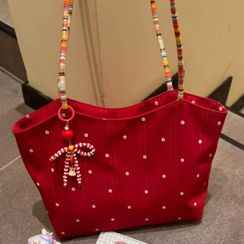 Canvas-Tote-Bag mit roten Blumen und Geflechtdetails